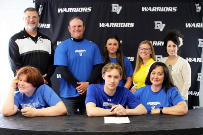 DVHS senior Bradley Coe (front row center) with his brother, Mason Coe, mother LeAndra Coe and (back row l-r) head coach Keith Olsommer, father Bradley Coe, sister Lilliana Coe, guidance counselor Crystal Ross and high school principal Dr. Nicole Cosentino.