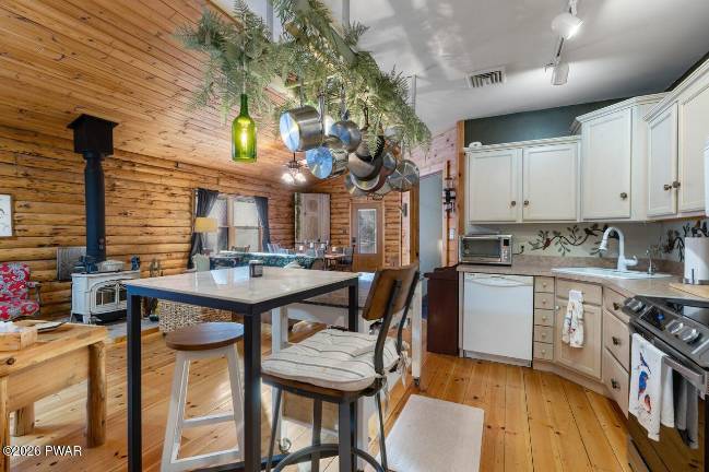 Log home combines rustic charm with modern amenities