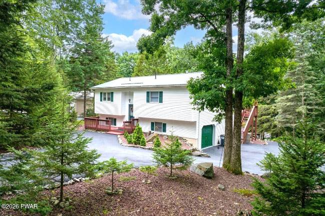 Walk down to your boat dock from this lakefront bi-level