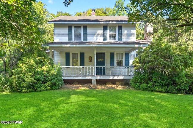 Updated farmhouse offers character, privacy and a walkable lane to town