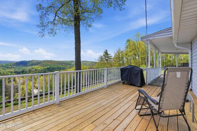 Live and work from this home with panoramic views, pond and pool