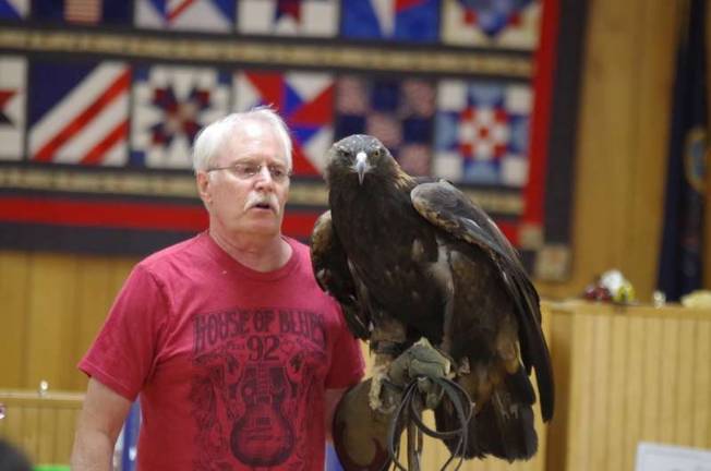 Delaware Valley Raptor Center Director William Streeter with Julia, a 22-year-old golden eagle. (Photo by George Leroy Hunter)