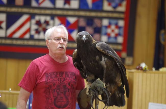 Delaware Valley Raptor Center Director William Streeter with Julia, a 22-year-old golden eagle