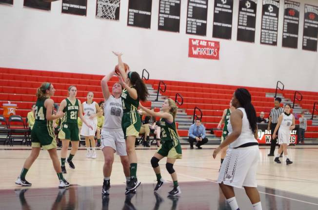 Delaware Valley’s Hannah Gallagher in the midst of a shot while Notre Dame’s Isabella Caporusso attempts to block. Gallagher scored 14 points.