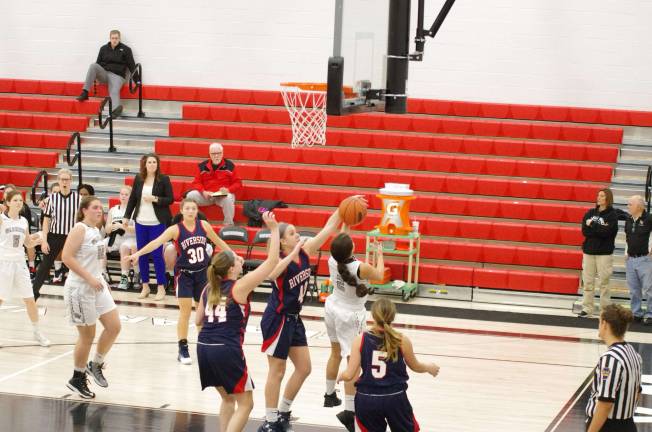 Riverside’s Jess Millan blocks the shot of Delaware Valley’s Jenna Pacella #2