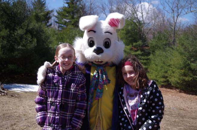 Twelve year old Mariah Kennedy and eight year old Jazmin Morgan of Port Jervis, N.Y. pose with the Easter Bunny.