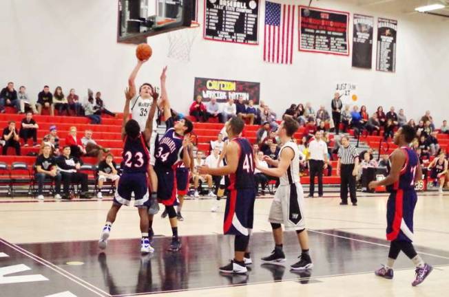 Delaware Valley's Shane Acoveno takes the ball to the air against double coverage. Acoveno scored 11 points.