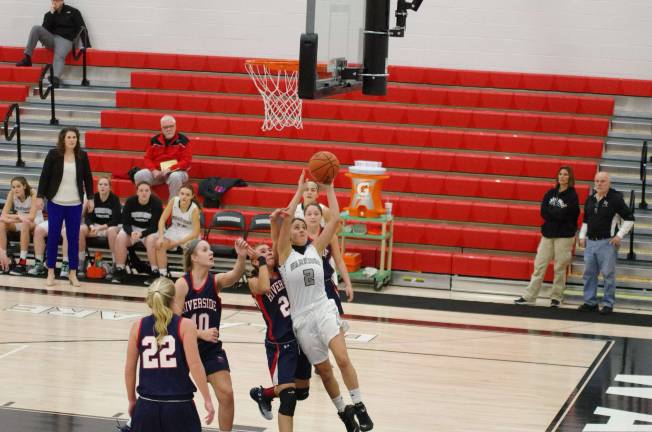 Riverside’s Jess Millan blocks the shot of Delaware Valley’s Jenna Pacella #2