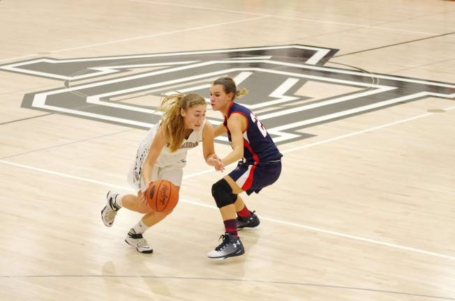 Delaware Valley Warrior Shelby Brittain is covered by Riverside Viking Haley Tilberry