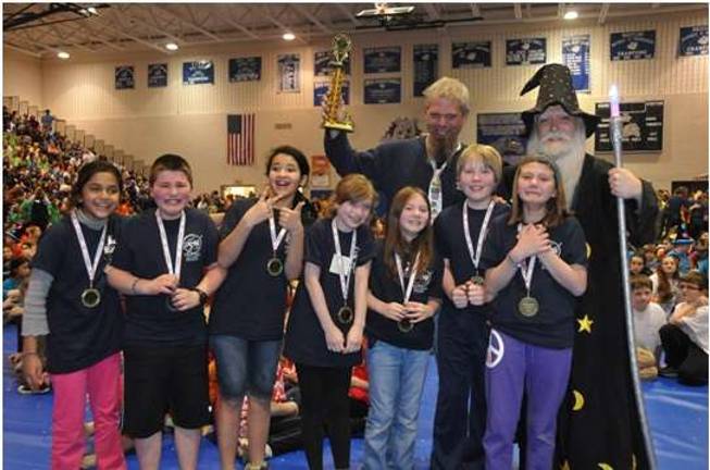 Dingman Delaware Elementary School: Problem 5, Silent Movie, First Place, Division 1. From left: Padmini Ramaswamy, Sawyer Yoncak, Noelani Felix, Kiley Huttman, Riley Hazelton, Tobias Shedd, Reilly Ziolkowski with Mr. Joe Ziolkowski and the Wizard of Pennsylvania.