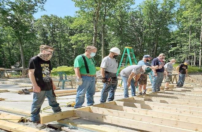 Volunteers with Habitat for Humanity of Pike County work to put up a wall (Photo provided)