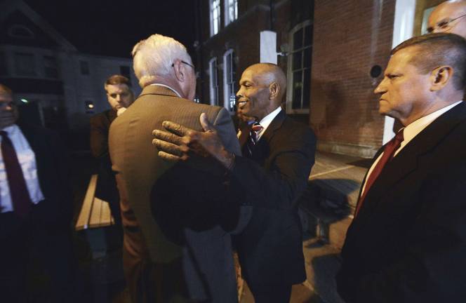 Pennsylvania State Police Commissioner Col. Tyree Blocker, right, and former Pennsylvania State Police Commissioner Frank Noonan embrace after convicted cop killer Eric Frein was sentenced to death late Wednesday, April 26, 2017, at the Pike County Courthouse in Milford, Pa. (Butch Comegys/The Times &amp; Tribune via AP)