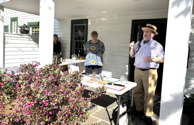 Left to right Carol McManus and Brian Carso (co-chairs of MRAW ) addressing guests on porch of John Wallace house in Milford