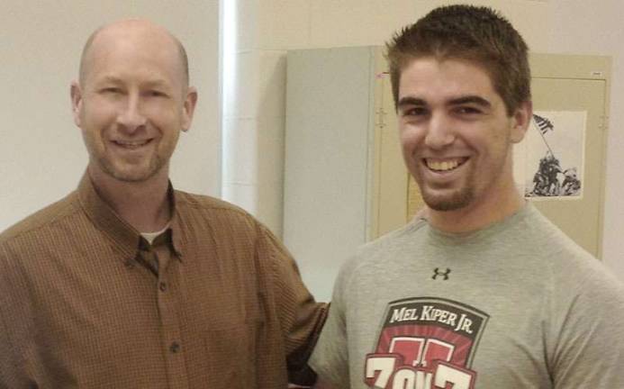 Eugene Burns with high school senior Joseph Vandenbos