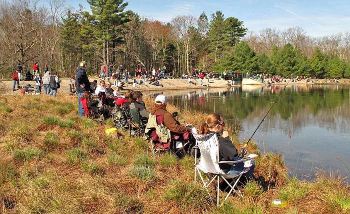 The banks of Lily Pond were lined up with relaxing parents and avid angler-kids during the Commissioner Fishing Derby.