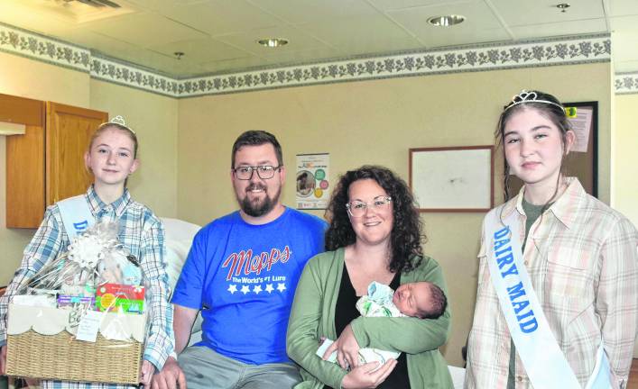 <i>From left: Dairy Miss Chloe Tyler, Robert Dodge III, Noreen Vogel (with baby Robert Dodge IV), and Wayne County Dairy Maid Zoey Tyler.</i>