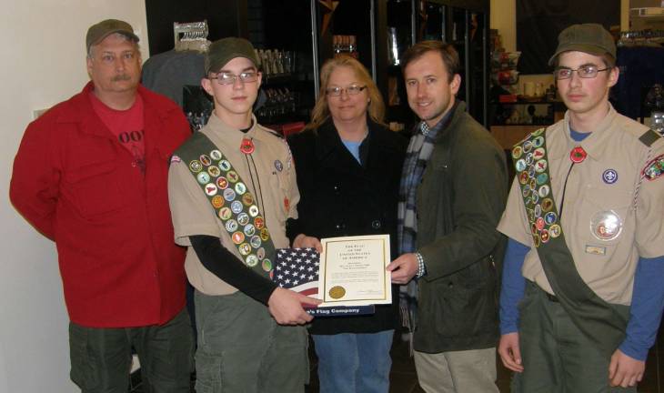 One flag deserves another: Scouts were presented with the flag that flew over the Capitol in their honor. Pictured (from left): Kevan Kelly, Scoutmaster; Wesley Witherel, Scout; Lori Strelecki, Pike County Historical Society Museum Director; Ryan Shucard, U.S. Rep. Marino&#x2019;s press secretary; and David Schotsch Jr., Scout. (Photo provided)