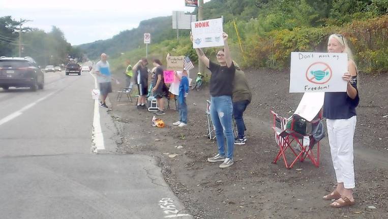 Anti-mask protestors in the afternoon before the meeting, on the highway across from Delaware Valley High School (Photo by Frances Ruth Harris)