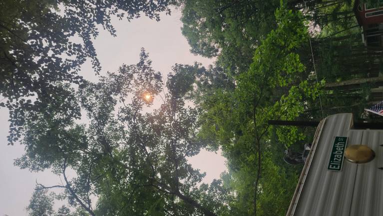 The sky covers smoke in Dingman Township on Thursday afternoon. Photo: Liz Holmes