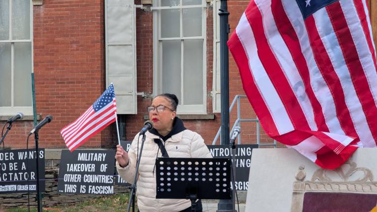 Pike County Commissioner Christa Caceres speaks at the beginning of the protest.