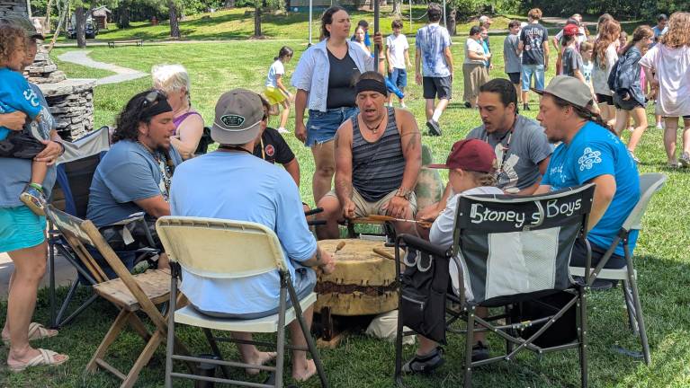 Drummers playing and singing during the Candy Dance for the summer campers at PEEC.