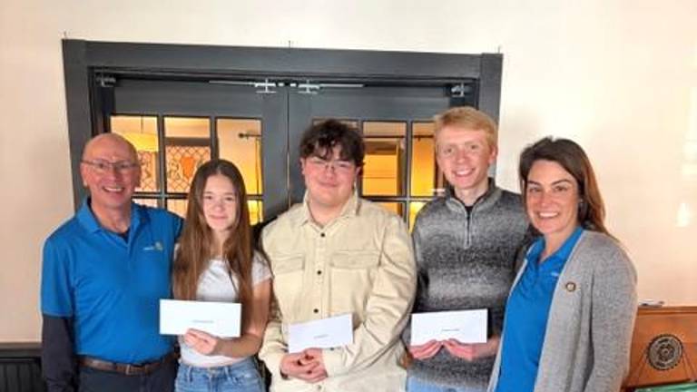 L to R: John Messer, Rotarian, Julia VanJahnke, first-place winner, Jason Helferty, second-place winner and Nat Carso, third-place winner, Jamie Dykstra, President.