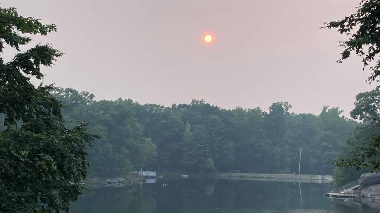 The lake at Wild Acres in Dingmans Ferry, PA shines with an orange reflection from the sun July 16. Photo provided.