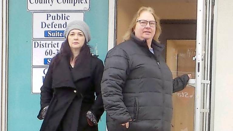 Lori Strelecki (right) emerges from the John Street County Complex in Milford (Photo by Frances Ruth Harris)
