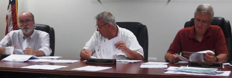 Dingman Township supervisors discuss roads (from left): Chair Tom Mincer, Dennis Brink, and Kerry Welsh (Photo by Anya Tikka)