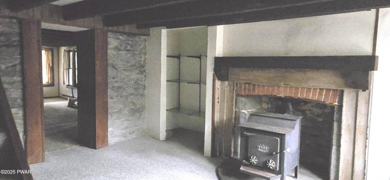 Enjoy water and woods from an historic lakefront home