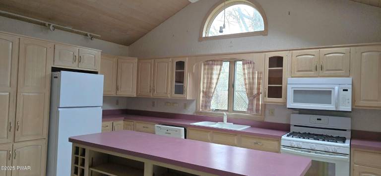 Enjoy water and woods from an historic lakefront home