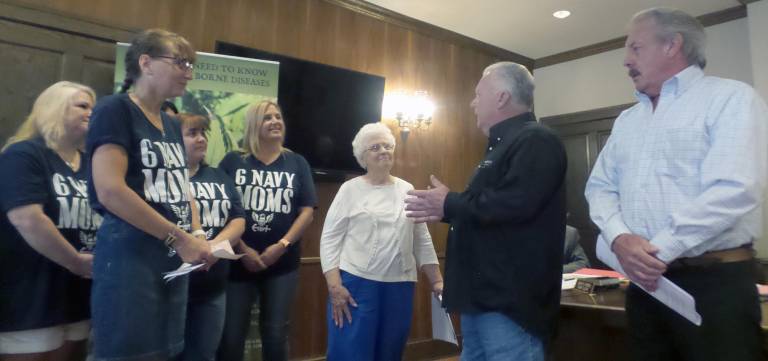 Tom Ryan and Allan Schatz of Vet Stock (right), pictured with Matamoras Mayor Janet Clark and the 6 Navy Moms, donated $5,000 in support of the project.