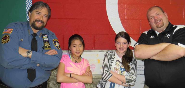 Fifth Grade Students of the Month: Grace Lee and Hailey Degli-Angeli with DVES Principal Aaron Weston. Not pictured: Gina Hanlon.