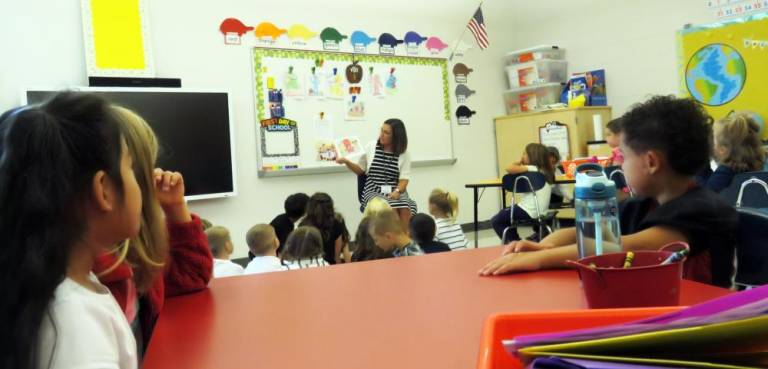 Students at the Delaware Valley Elementary School met their principal, Mrs. MaryAnn Olsommer. In this photo, Mrs. Olsommer read a book, to the first grade classes of Janel Stewart and Tammy Curtis.