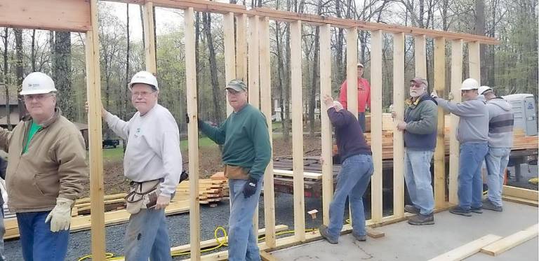 Habitat for Humanity volunteers build a home