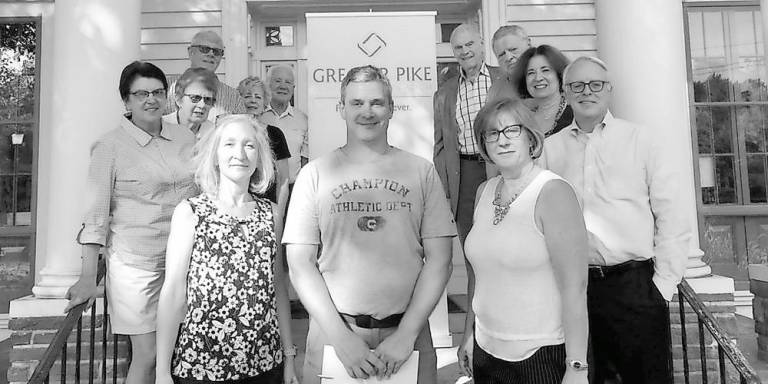 Charles Petersheim (center) and members of the Greater Pike Community Foundation Board ( Photo provided)