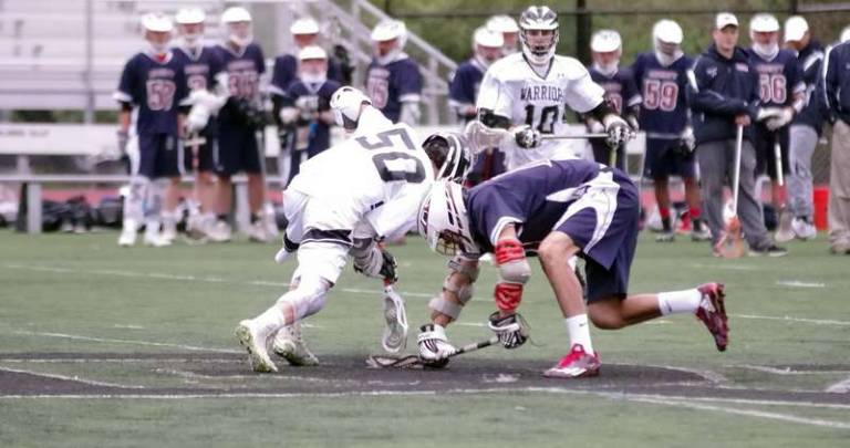 Delaware Valley's Anton Mackey (50) scoops up the ball with his crosse and begins to move away with it during the face-off
