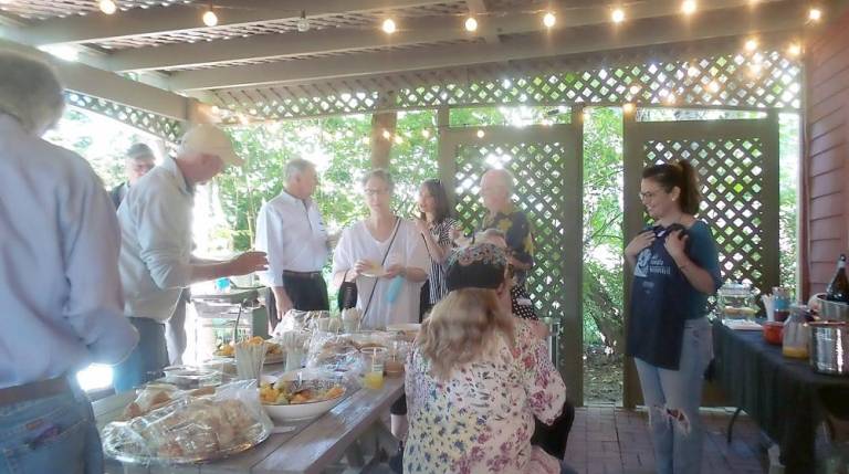 Porch politicking in Milford (Photo by Frances Ruth Harris)