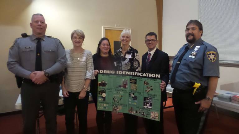 Lt. Brian Vennie, Commander of the Blooming Grove State Police Headquarters; Margaret Dedrick, event coordinator; Catholic Social Services Erin C. McClay; and Pike County Coroner Christopher Brighton; Pike Carbon and Monroe’s Mental Health and Development Services, Elaine Tucker; Catholic Social Services Erin C. McClay; Pike Coroner Christopher Brighton and Pike County Sheriff Philip Bueki just prior to the panel discussion. (Photo by Frances Ruth Harris)
