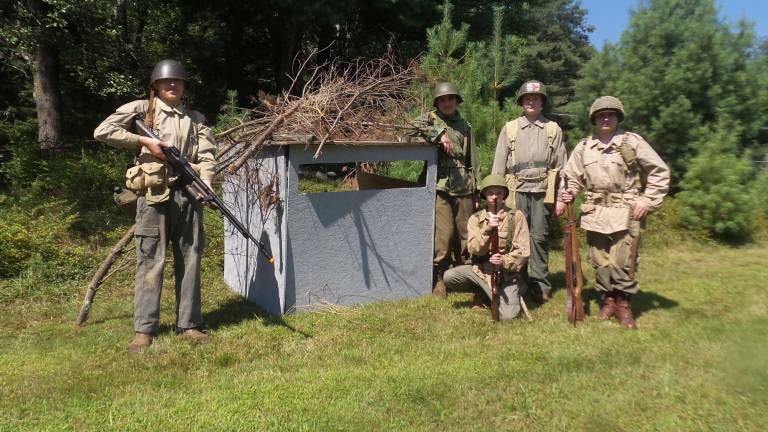Outside the bunk, Mark DeBlock, Terrance Ring, Andrew Phillips, Ronald Syme and (kneeling) Matthew Bailey. (Photo by Frances Ruth Harris)