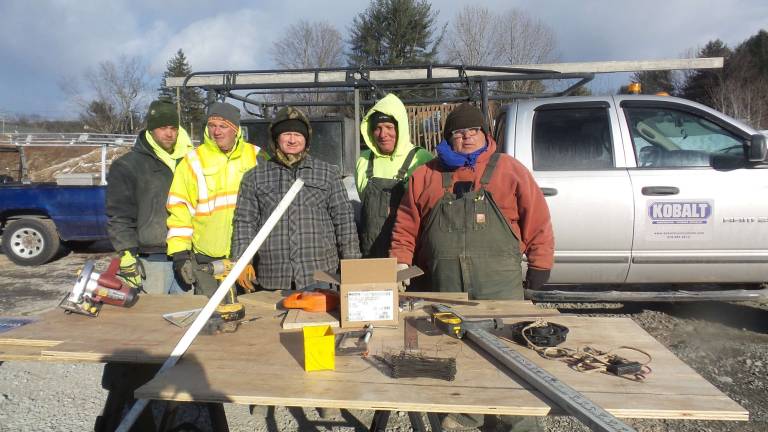 The Kobalt crews stopped for a fast picture in the intense cold (from left): Adam Macbreargy, Bob Chairge, Mike Pearn, Mark Belotti and PJ Mancuso (Photo by Frances Ruth Harris)