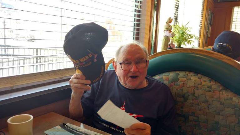 Gene Schneider, pictured at the Milford Diner, teared up as he described the moving reception he and other veterans received everywhere they went (Photo by Anya Tikka)