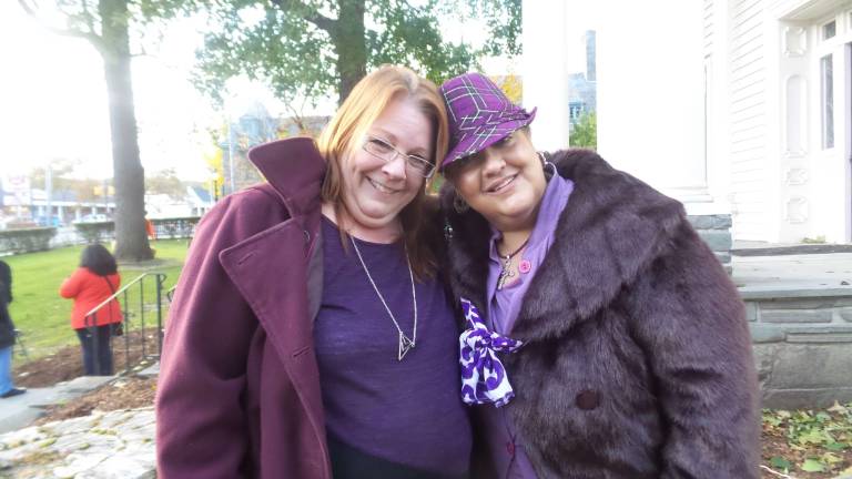 The two featured speakers, Janine Galla and Yvonne Accomawso, share time before their speeches (Photo by Frances Ruth Harris)