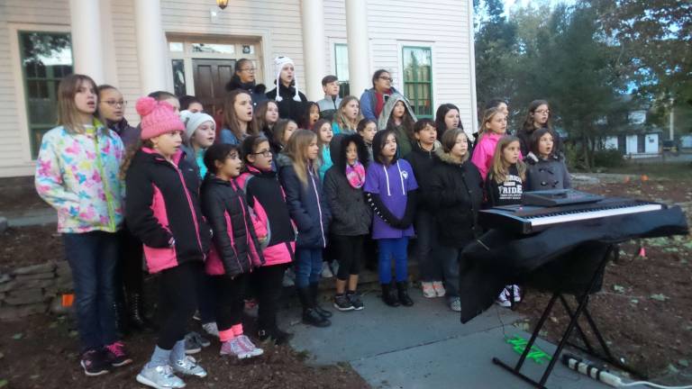 The Delaware Valley Elementary Choir sang two songs: the first in Hebrew, "Truth, Justice, Peace," and the second in English, "Somewhere Over the Rainbow" (Photo by Frances Ruth Harris)