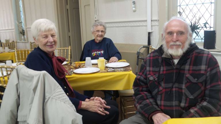 Inga Lukaszuk, Ceil Sudol and Max Riben ready to enjoy the community feast