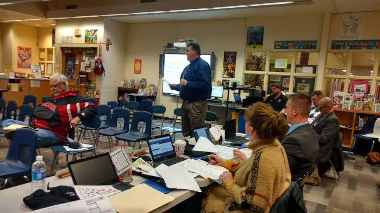 Administrative Services Director Chris Lordi explains new maintenance building plans. Maintenance Director Marvin Eversdyke is seated toward the back (Photo by Anya Tikka)
