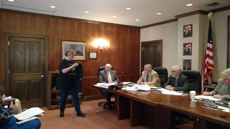 Pike Autism Support Services Director Jean Marie Passaro shows the center's themed T-shirt for 2017, "Growing Awareness" (Photo by Anya Tikka)