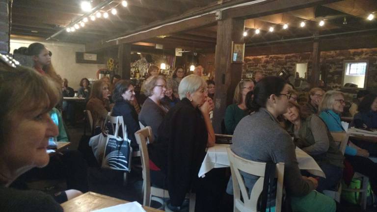Attendees of The Women are Always Write panel listen attentively.
