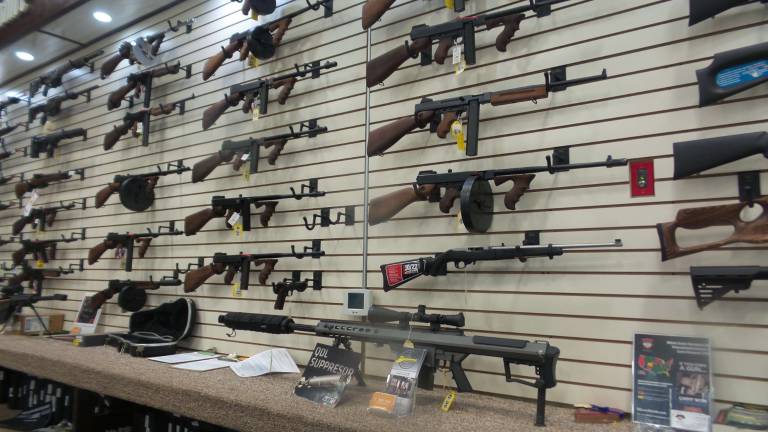 Guns at the Kahr Arms wearhouse and retail center in Greeley, owned by Justin Moon, the brother of the pastor of the World Peace and Unification Sanctuary Church, Sean Moon (Photo by Frances Ruth Harris)