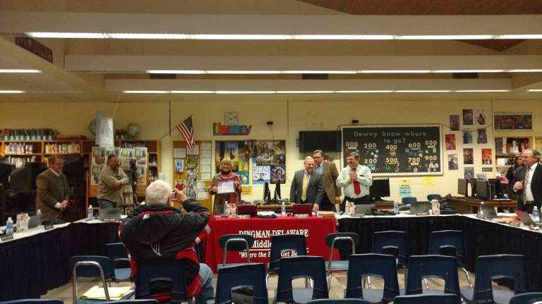 DV School Board President Pam Lutfy holds up the PA School Board Association's Certificate for her 20 years of service as a school board member. (Photo by Anya Tikka)